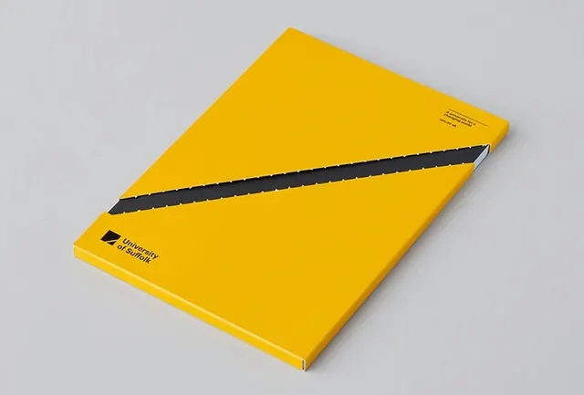 Yellow notebook with black diagonal stripe, minimal, geometric, vibrant