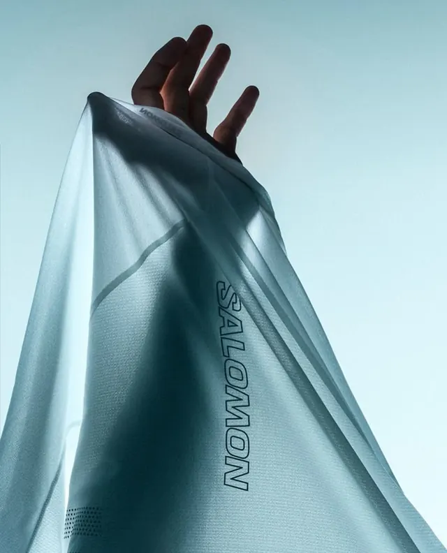 Product flatlay with turquoise fabric, minimal, playful, cool