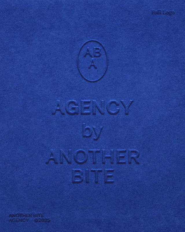 Brand identity stationery mock-up on deep blue embossed paper, minimal, corporate-clean, dark
