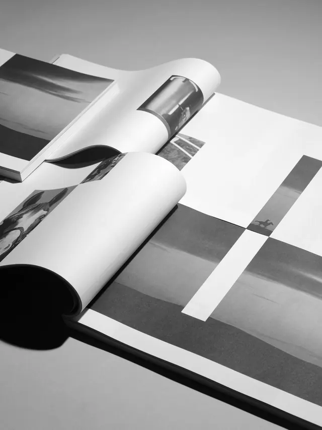 Swiss book design mockup with rolled pages, swiss, minimal, monochrome