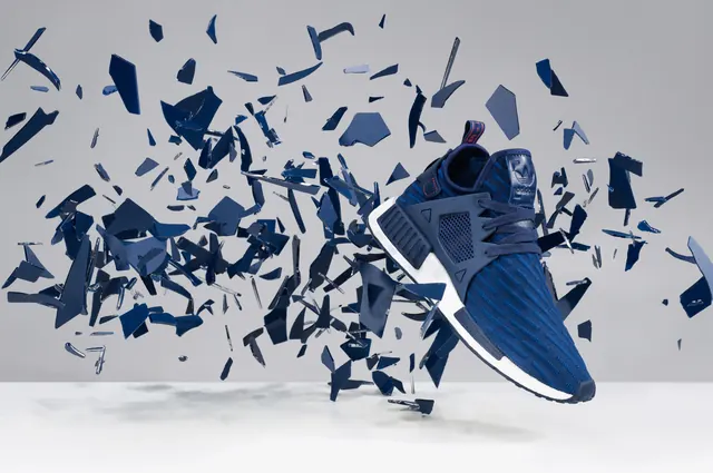 Magazine spread with blue sneaker explosion, technical, 3d-render, cool
