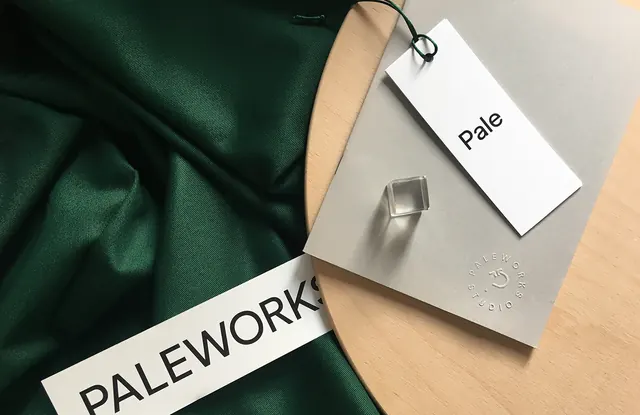 Paleworks brand identity flat lay, minimal, corporate-clean, dark