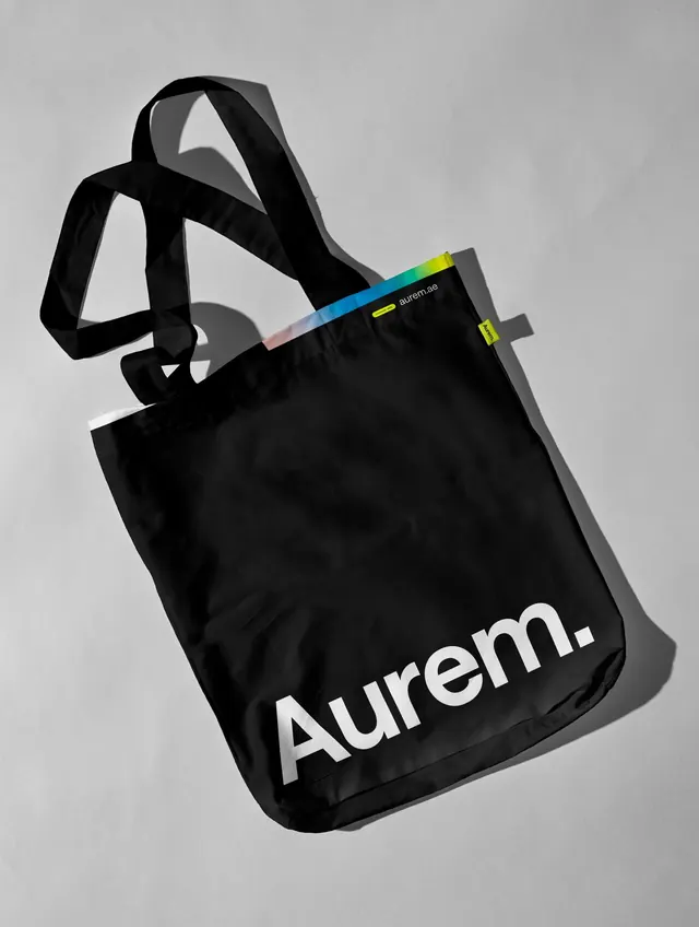 Branded tote bag with ribbon accent, minimal, flat, dark
