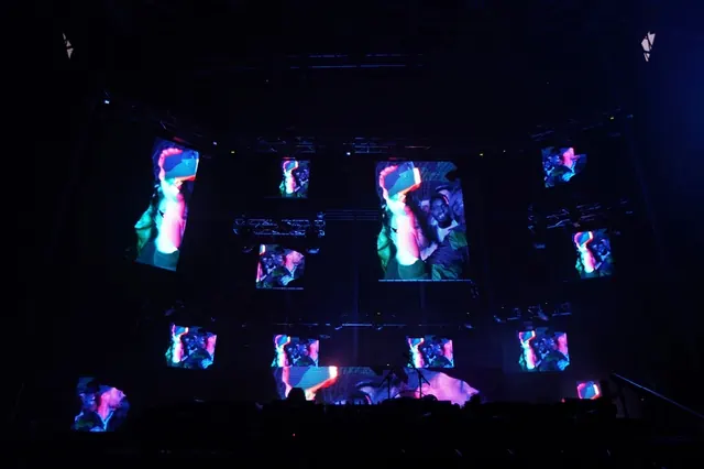Weirdcore neon festival stage design, dark-mode, psychedelic, dark