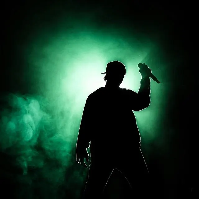 Concert silhouette with atmospheric stage lighting, photographic, dark-mode, dark