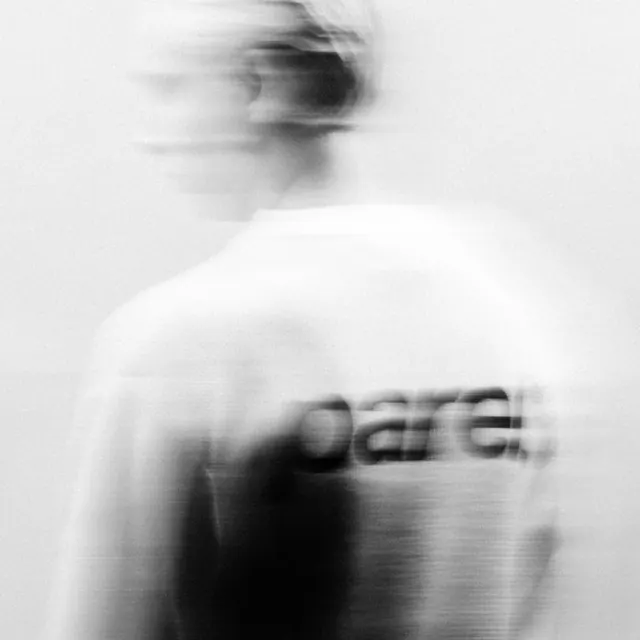 Motion-blurred parel tee photograph, monochrome, minimal, monochrome
