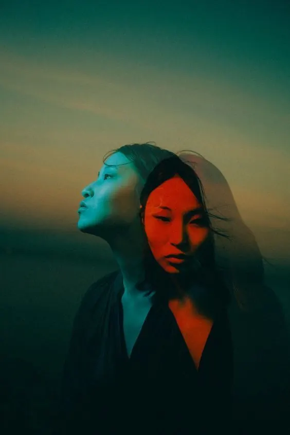 Double-exposure teal and red portrait, photographic, editorial, gradient