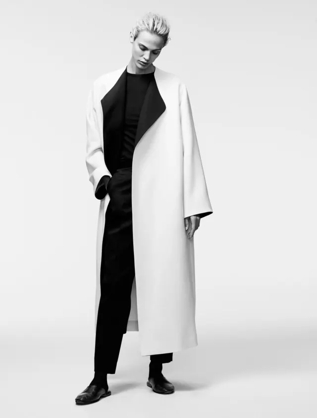 Oversized white coat fashion portrait, minimal, monochrome, monochrome
