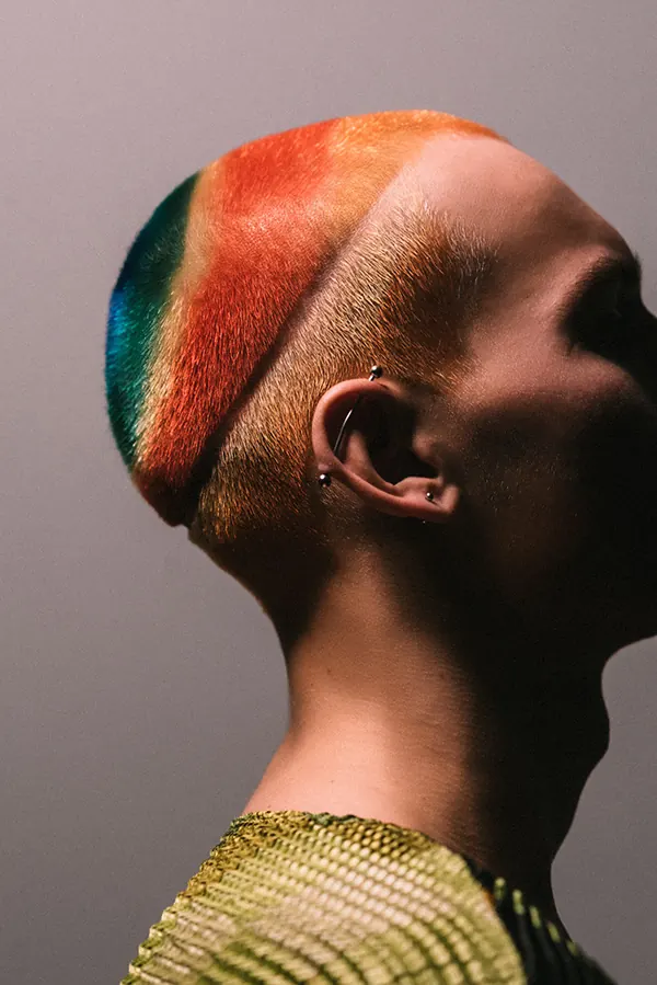 Rainbow buzz cut profile portrait, photographic, maximalist, vibrant