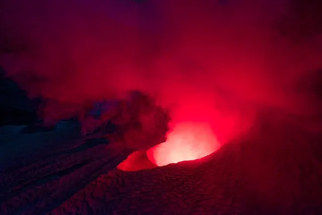 Lava eruption nighttime landscape photograph, photographic, dark-mode, dark