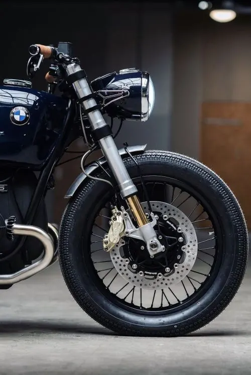 Custom navy BMW motorcycle front detail, photographic, technical, dark