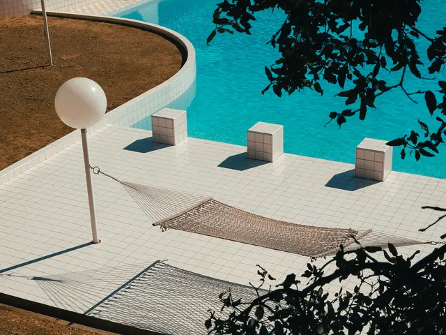 Tiled poolside hammock from above, minimal, photographic, light