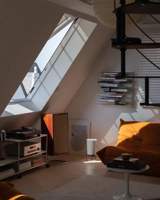 Attic listening room with orange sofa, minimal, photographic, warm