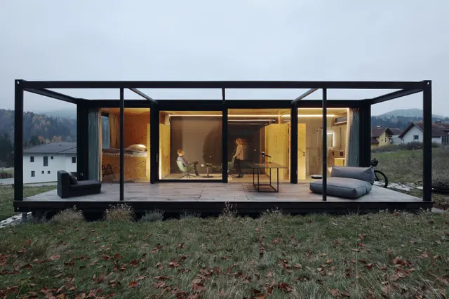 Glass-walled modular alpine cabin, minimal, photographic, cool