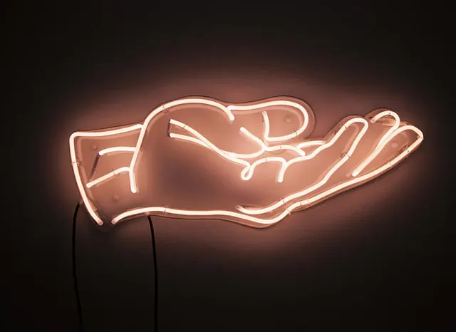 Peach neon open hand sign, minimal, photographic, dark