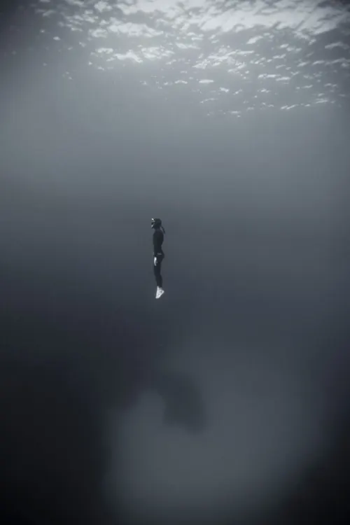 Monochrome underwater free diver, minimal, photographic, monochrome