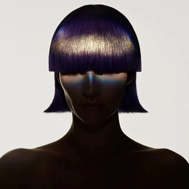 High-contrast monochrome portrait with metallic accent, photographic, minimal, dark