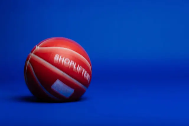 Shoplifters basketball on blue, minimal, photographic, vibrant
