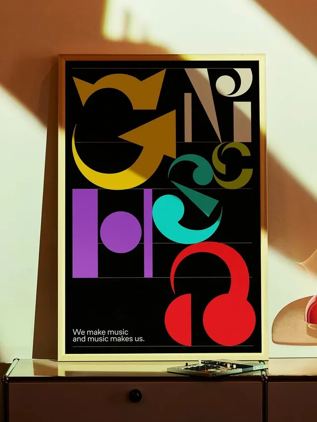 Framed music poster in sunlit room, geometric, playful, dark