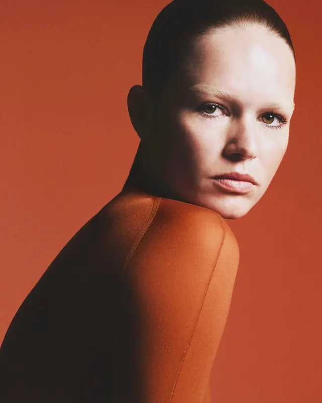 Orange monochrome fashion portrait, editorial, photographic, warm