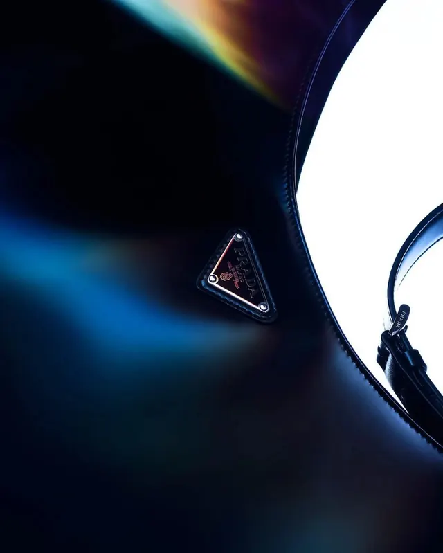 Headphone detail with blue light refraction, photographic, technical, dark
