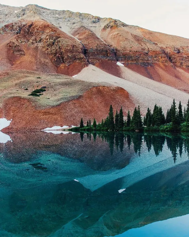 Alpine landscape with turquoise lake, photographic, organic, earthy