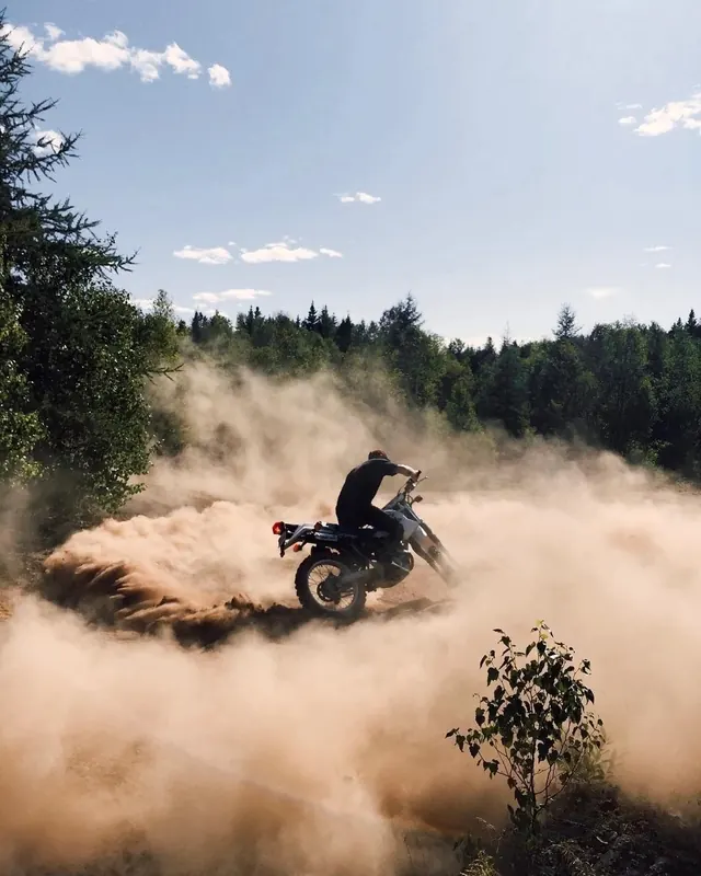 Motorcycle dust spray action shot, photographic, action, warm