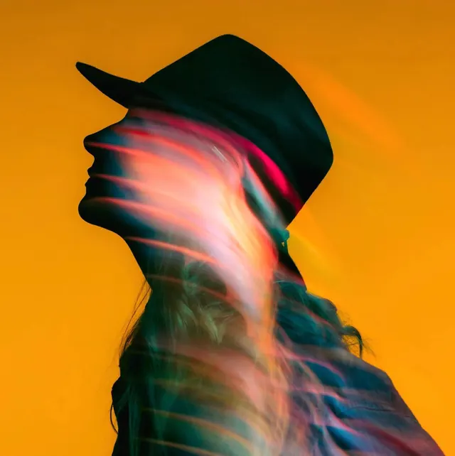 Glitch silhouette portrait with motion blur, photographic, digital-manipulation, vibrant