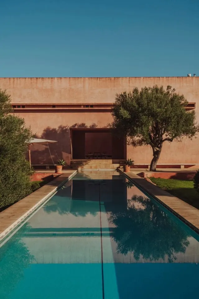 Minimal courtyard pool with earth-toned architecture, architectural, minimalist, warm
