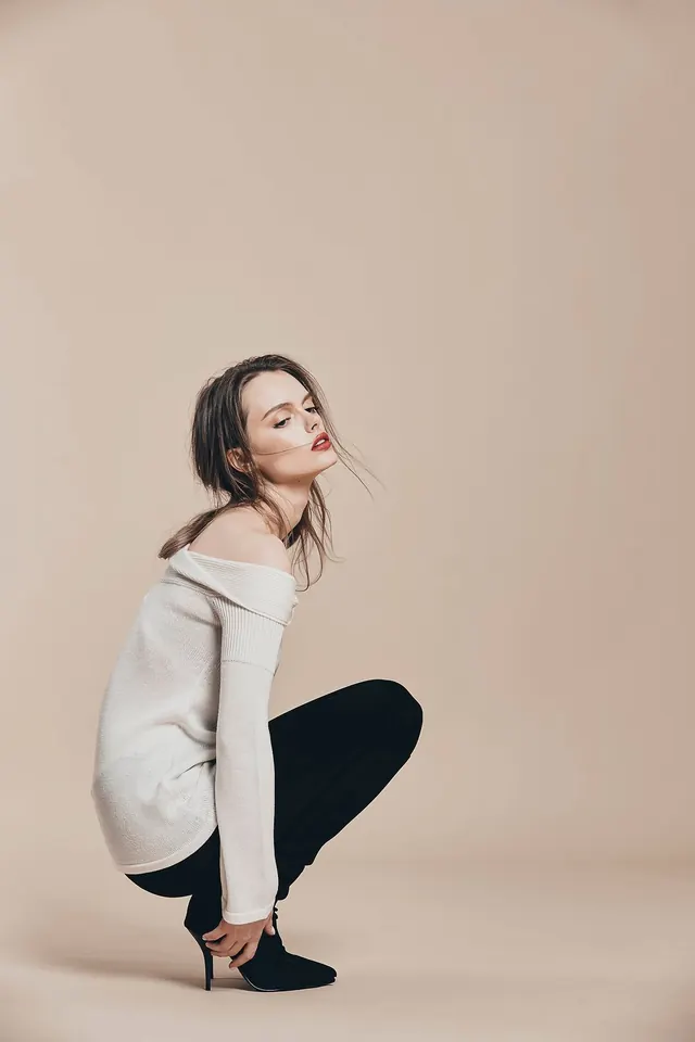 Fashion lookbook portrait with neutral palette, photographic, editorial, warm