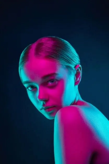 Neon-lit portrait with color-split lighting, photographic, dark-mode, dark