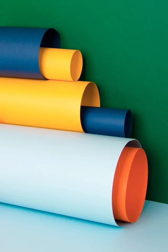 Stacked paper rolls color study, minimal, photographic, vibrant