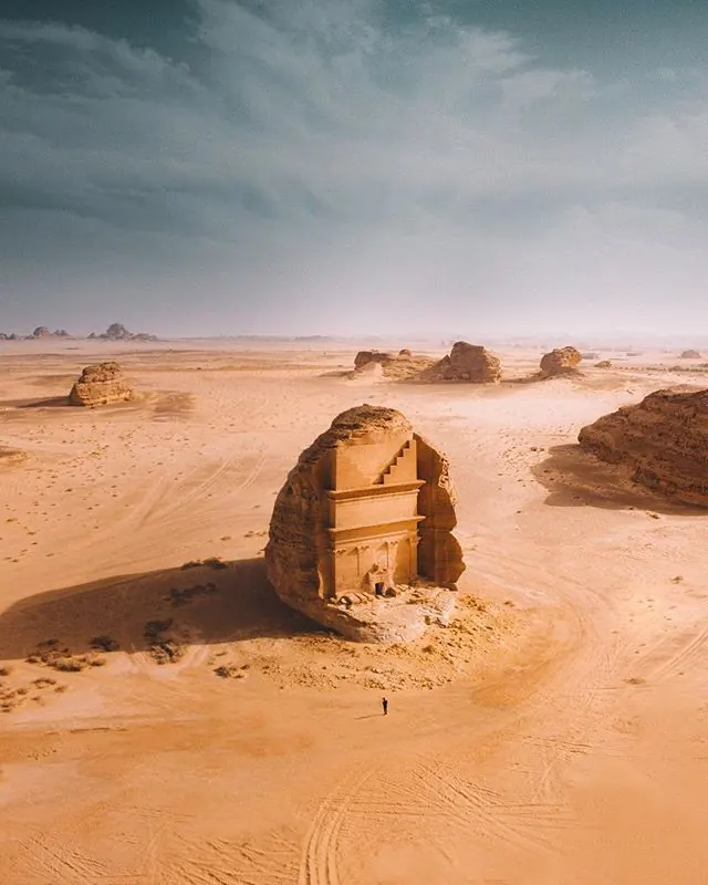 Ancient stone doorway in desert landscape, photographic, organic, warm