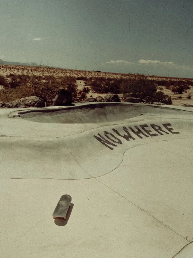 Skateboard in concrete skate bowl with vintage aesthetic, photographic, editorial, earthy