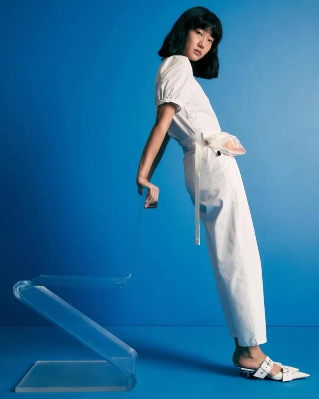 Fashion lookbook with model and acrylic platform, photographic, editorial, vibrant
