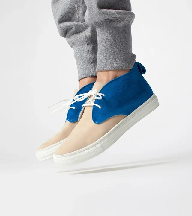 Two-tone suede sneaker product shot, photographic, minimal, light