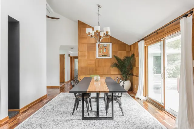 Mid-century dining room with wood and natural light, organic, light-mode, warm
