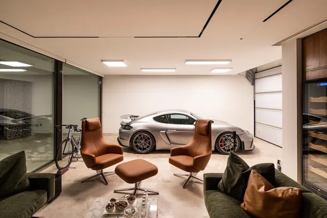 Modern garage lounge interior, photographic, minimal, warm