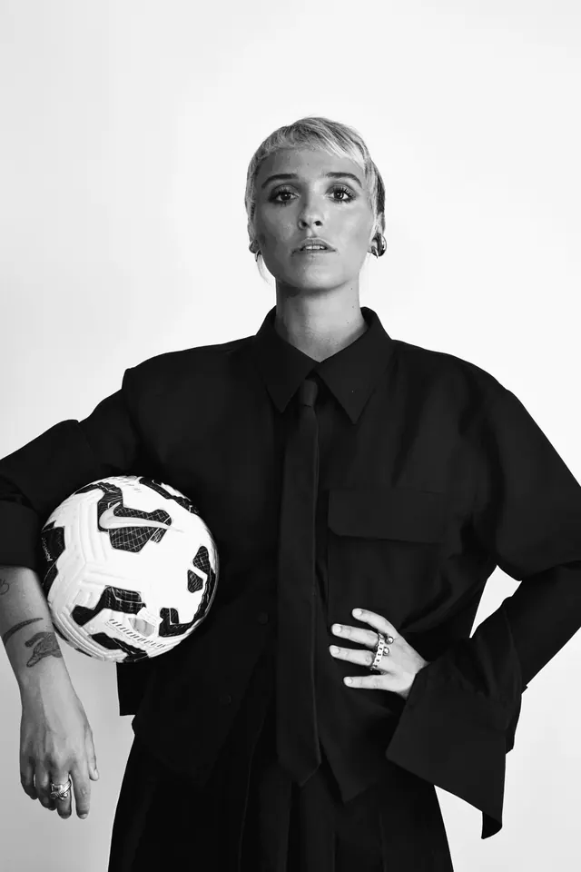 Female athlete monochrome portrait soccer ball, photographic, professional, monochrome