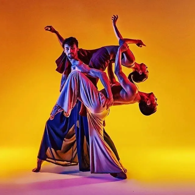 Studio portrait with warm gel lighting, photographic, bold, warm
