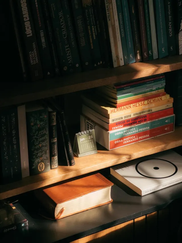 Styled bookshelf with warm editorial lighting, photographic, editorial, warm