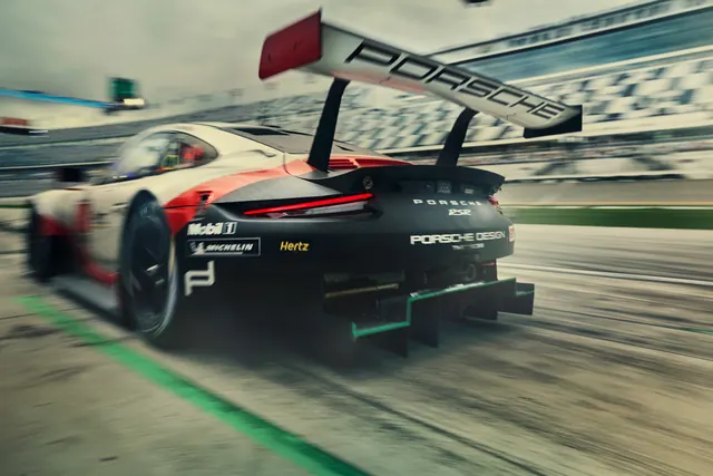 Porsche racing car in motion blur, photographic, technical, cool