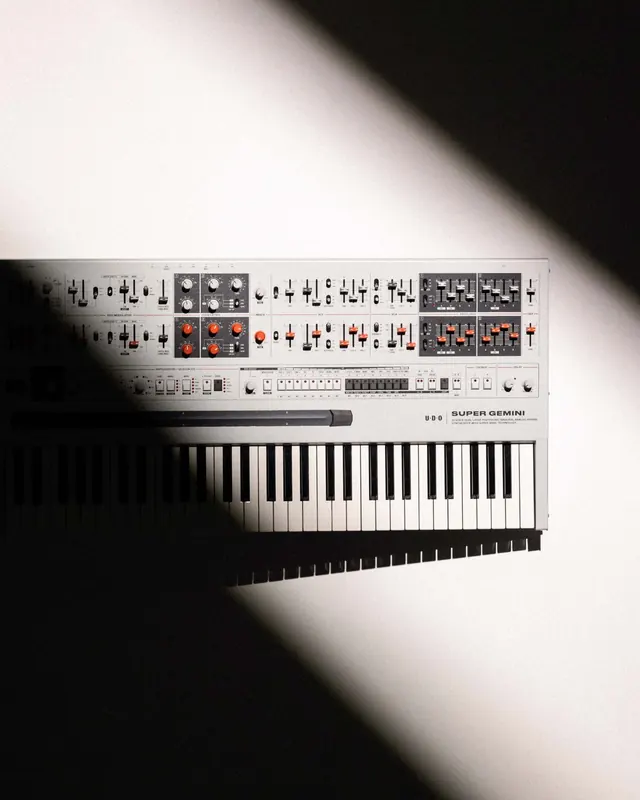 Super Gemini synthesizer product shot, photographic, minimal, light