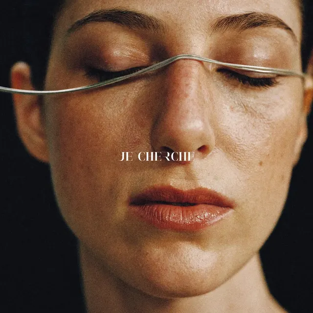 Beauty portrait with text overlay, photographic, editorial, warm