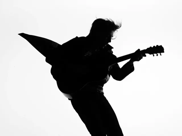 Silhouette musician with guitar dynamic pose, photographic, minimalist, monochromatic