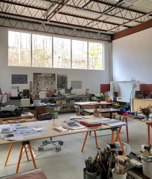 Creative studio workspace with high ceilings, photographic, minimal, light