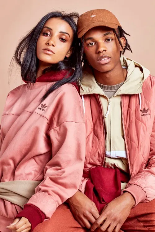 Lifestyle fashion portrait with warm earth tones and Adidas styling, photographic, minimalist, warm