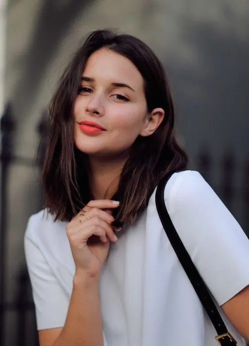Portrait of woman in white shirt with soft styling, photographic, minimal, light