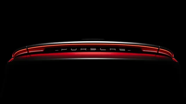 Red brake light strip on dark background, minimal, photographic, dark