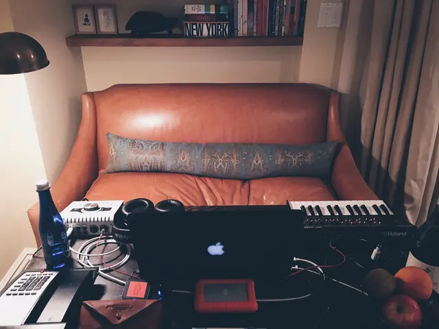Creative workspace with music gear, photographic, editorial, warm